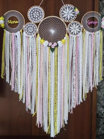 Double the dreams, twice the love. We created this pink and yellow floral cluster dreamcatcher for twins 'Meera' and 'Gargi', making it a heartfelt gift to celebrate their special bond.