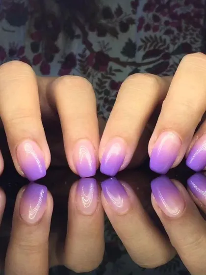 A vibrant purple ombre, fading from a light lilac to a deep violet at the tips.