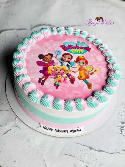 A simple and sweet half-kg cake with a Butterbean's Café theme, perfect for a smaller celebration.