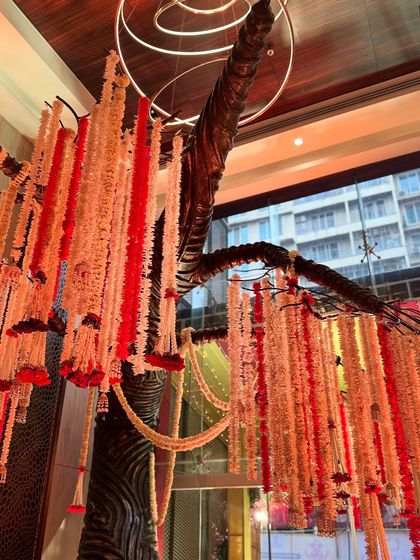 A view of the floral installation from a different angle, showing how it interacts with the modern architecture of the venue.