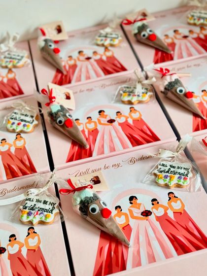 Adding a touch of fun with custom cookies and a hot chocolate cone! These little details make the bridesmaid proposal boxes even more memorable.