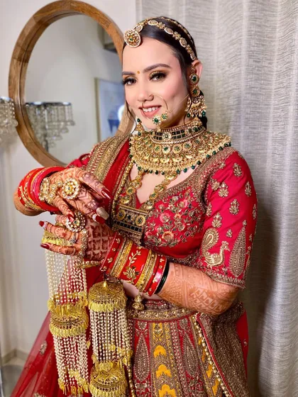 Capturing the essence of a Rajasthani bride. This look is all about tradition and grandeur, featuring rich colors, intricate jewelry, and makeup that highlights her royal grace.