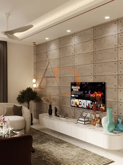 The floating TV console and curved sofa maintain a sense of spaciousness, while the textured wall provides a dramatic focal point.