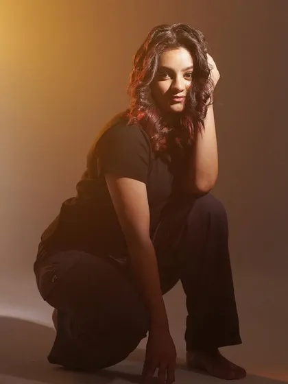 A simple, basic but confident pose from a studio shoot.