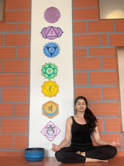 A memory from our second shala. The warm brick tones and chakra art created a unique energy for practice, and we carry those fond memories into our new space.