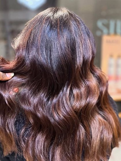 Love is in the hair. This image captures the beauty of freshly styled hair with a healthy sheen.