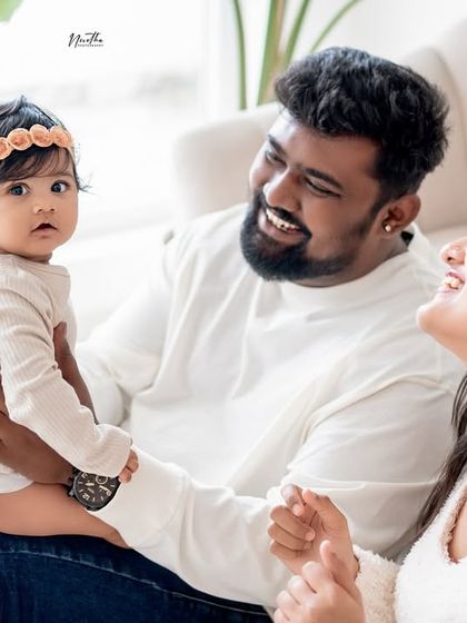 A relaxed and happy family portrait on the couch.