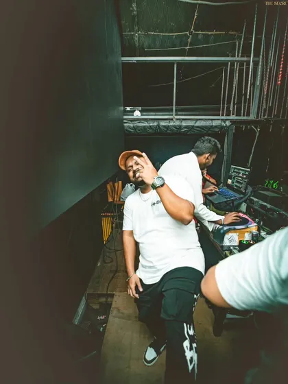 A candid moment captured backstage before a show. This behind-the-scenes photo shows the relaxed and happy vibe I maintain, even in the moments before hitting the stage.