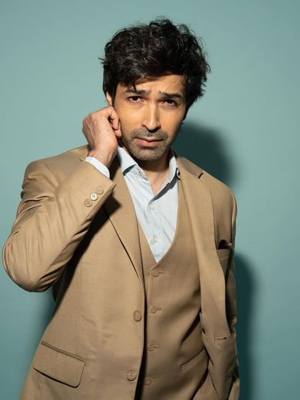 A close-up with a slightly more intense and thoughtful expression, demonstrating his versatility as an actor.