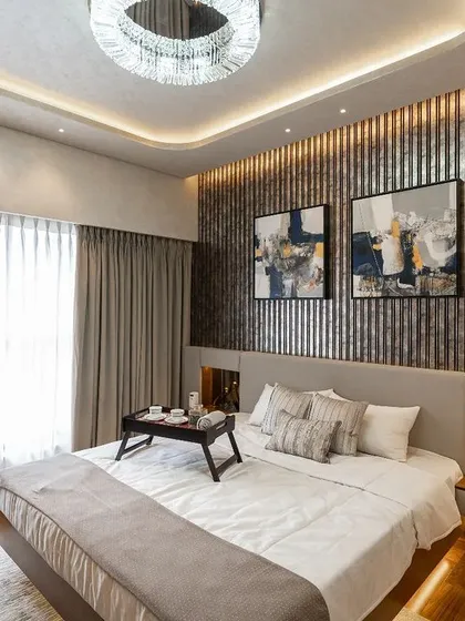 I believe a bedroom should be a personal retreat. In this master bedroom, I combined a dramatic fluted wall panel with soft, ambient lighting and a custom-designed bed to create a luxurious and serene atmosphere. It’s a space designed for ultimate comfort and relaxation at the end of a long day.