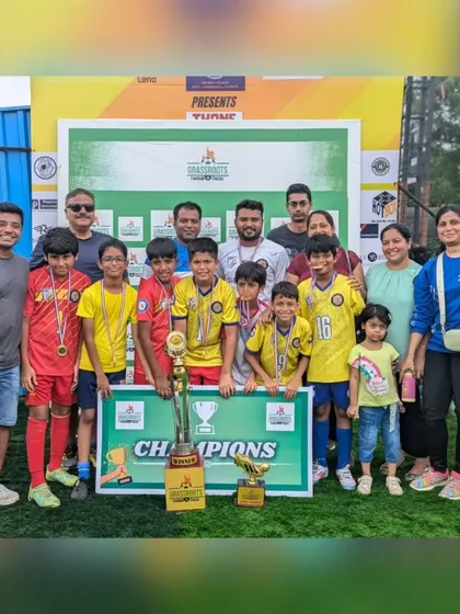 Players, coaches, and proud parents celebrating the U11 championship win at the Grassroots Football Fiesta.