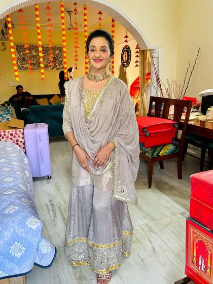 A full-length shot showing her complete look. I am available for home service across Noida and surrounding areas.