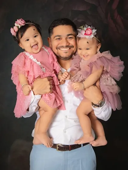 A father's love for his twin daughters shines so brightly in this portrait. Capturing these strong, gentle bonds is one of the most rewarding parts of my job.