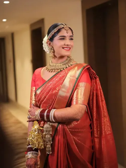A beautiful portrait of the bride in a hallway. Her makeup is radiant and her smile is infectious, creating a timeless and elegant image.