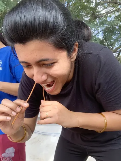A student practices Sutra Neti, a yogic cleansing technique using a thread to clear the nasal passages. We guide students safely through these advanced practices.
