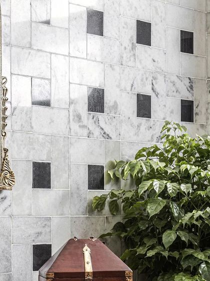 The intricate pattern of the black and white marble wall in the master bathroom, a testament to our love for detailed and timeless design.