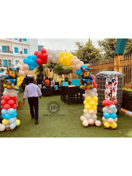 Guests are greeted by their favorite characters right from the entrance. This image shows the full scope of the welcome decor, setting the stage for an action-packed party.