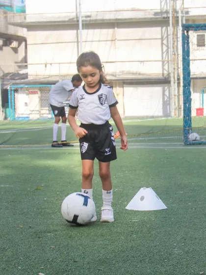 Focus and precision during a ball control drill. We use simple tools like cones to create effective training scenarios that build a strong technical foundation.