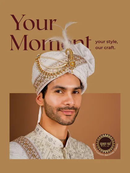 The complete groom's look is in the details. This close-up showcases a beautifully crafted safa (turban), featuring delicate embroidery and a royal kalgi, designed to be the crowning glory of your wedding attire.