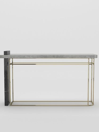 A studio view of our marble and metal console table, showcasing its minimalist form and the beautiful contrast of materials.
