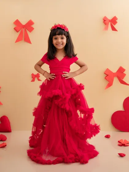 A sweet and simple pose from our Valentine's Day shoot, with this girl in her red dress looking confidently at the camera.
