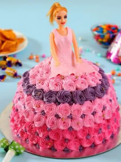 Make your child's birthday magical with a stunning Barbie doll cake. This design features intricate rosette piping and is a guaranteed centerpiece for any kids' party. We can customize the colours and flavour to your liking.