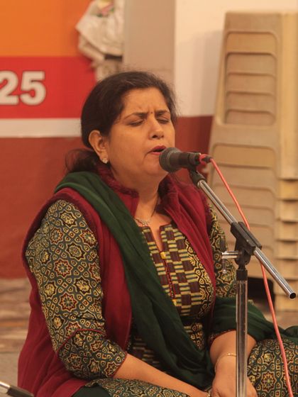 A student singing with her eyes closed, fully connected to the spiritual essence of the music.