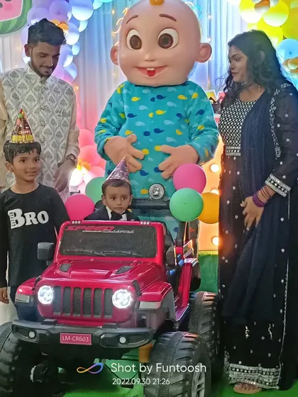 The birthday boy making a grand entrance in a toy jeep, joined by our Cocomelon mascot. We help plan these special moments to make the celebration even more memorable.