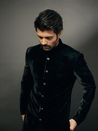 This shot highlights the beautiful drape and fit of the Sawan Gandhi bandhgala.