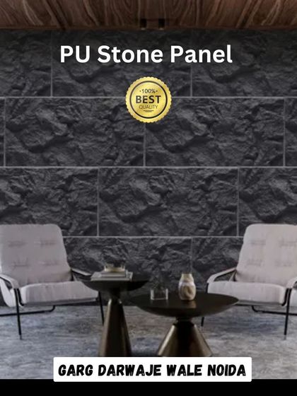 A living room featuring a feature wall made from our black PU Stone Panels. The panels provide a dramatic, textured backdrop that enhances the modern furniture.