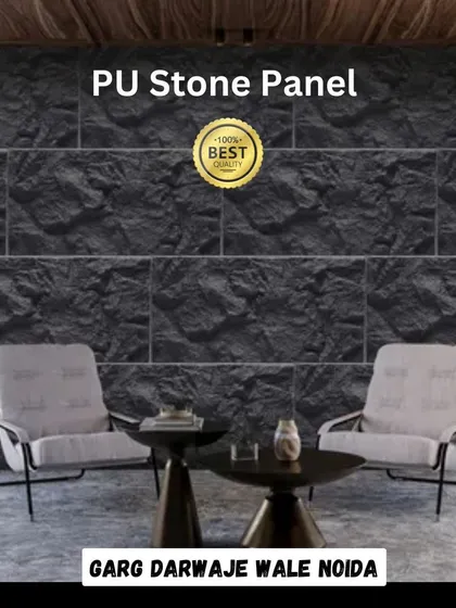 A living room featuring a feature wall made from our black PU Stone Panels. The panels provide a dramatic, textured backdrop that enhances the modern furniture.