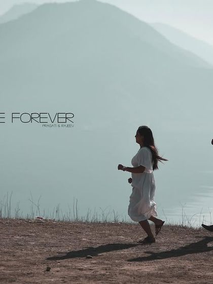 A cinematic shot of a couple running along a lakeshore, with "Love Forever" text. This is a perfect, movie-like image for an album.