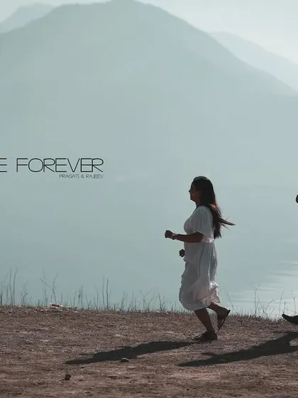 A cinematic shot of a couple running along a lakeshore, with "Love Forever" text. This is a perfect, movie-like image for an album.