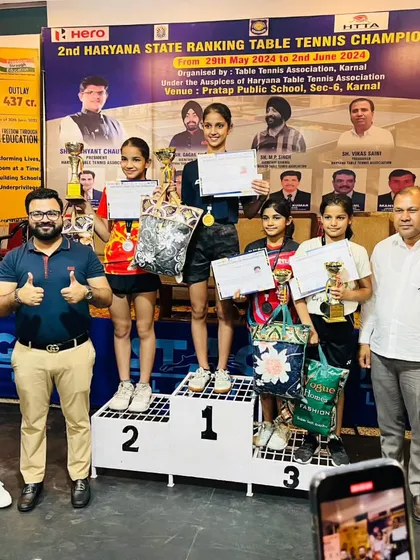 Here I am with our champions on the podium at the 2nd Haryana State Ranking Table Tennis Championships. It is an honor to stand with these talented young athletes as they receive their awards.