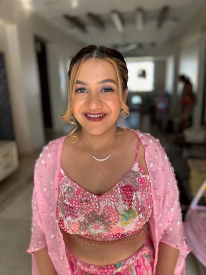 A full-face portrait showing her complete look.