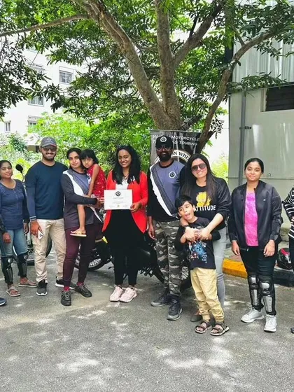 A graduate and her family celebrate her achievement. Learning to ride is a personal victory that inspires everyone around you.