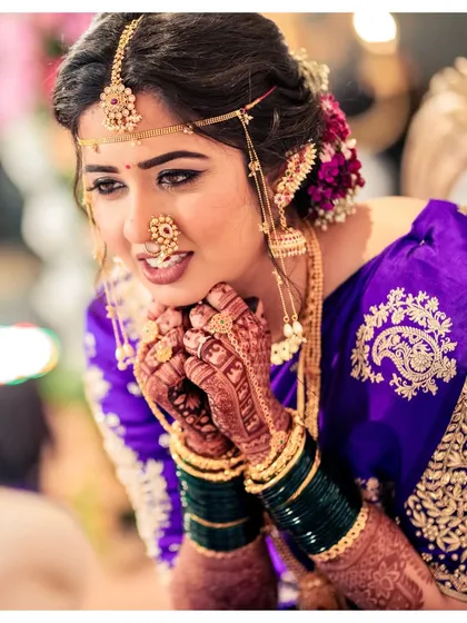 An emotional moment captured during the wedding rituals. Akshaya's minimal makeup, with its focus on clean skin and defined eyes, stayed flawless through all the happy tears and laughter.
