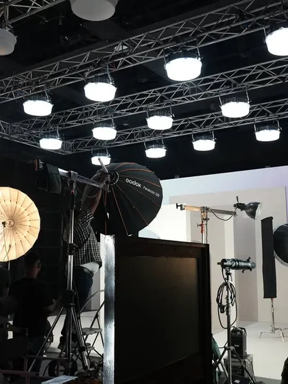 Behind the scenes of a shoot for Limelight, showing our lighting setup. We used a large overhead truss rigged with Creamsource SpaceX fixtures to create a soft, even top light.