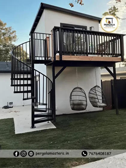 This project features a functional spiral staircase providing access to a raised deck. The space-saving design is ideal for compact backyards, connecting different levels while adding a modern architectural element.