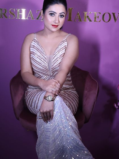 A sophisticated rose gold and white sequin gown. The geometric pattern and body-hugging silhouette make this a glamorous and elegant choice for a cocktail event.