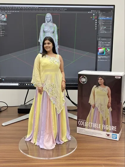 A collectible figure version of me in a multi-color Indo-Western gown. This shows how our unique designs can be a piece of art.