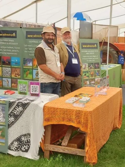 Two of our senior naturalists at our booth. Their deep knowledge and field experience are what make our tours truly exceptional.