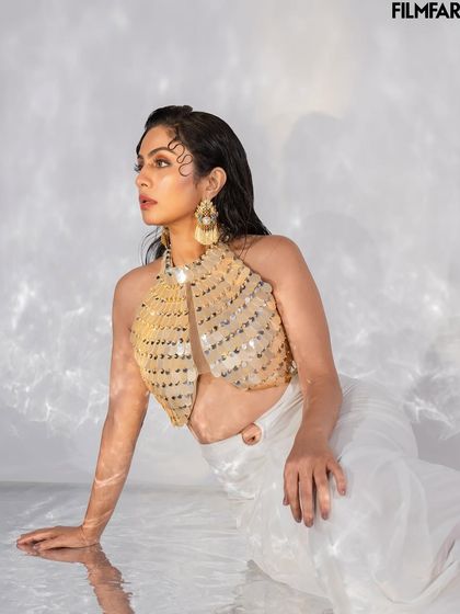 Another angle from the water-based set for Filmfare. This image captures a candid, off-gaze moment, adding a layer of depth to the editorial story.