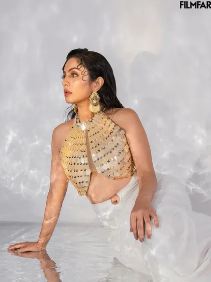 Another angle from the water-based set for Filmfare. This image captures a candid, off-gaze moment, adding a layer of depth to the editorial story.
