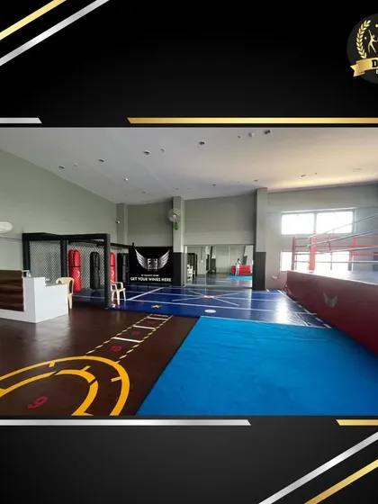This view showcases the integrated design of our action training center, with the boxing ring, matted floors, and open space all part of a comprehensive fitness environment.