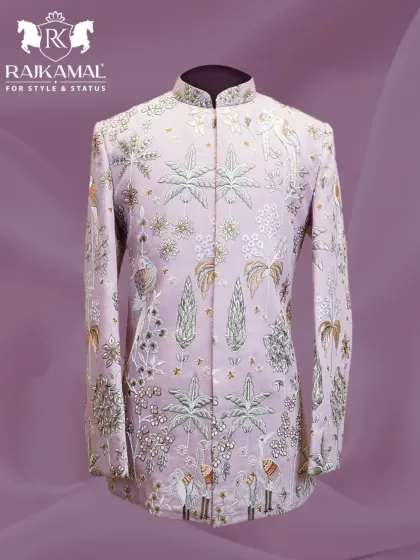 A truly unique Jodhpuri in a soft lilac, featuring exquisite embroidery of birds and foliage. This piece is luxury that speaks for itself.