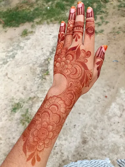 The gorgeous, even stain of a full-arm bridal design. My natural henna ensures a consistent and beautiful color from your fingertips to your elbow.