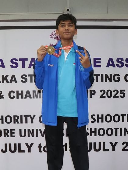 A member of our Sub-Youth Men's Air Rifle team celebrating his gold medal win in the team event.