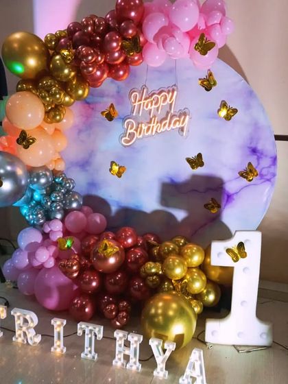 The marbled backdrop setup with added butterfly details for a touch of whimsy.