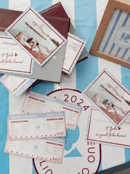 Custom-designed party stationery, including 'River Cruises' boarding passes and postcards, adds a personal and immersive touch to the sailor theme.